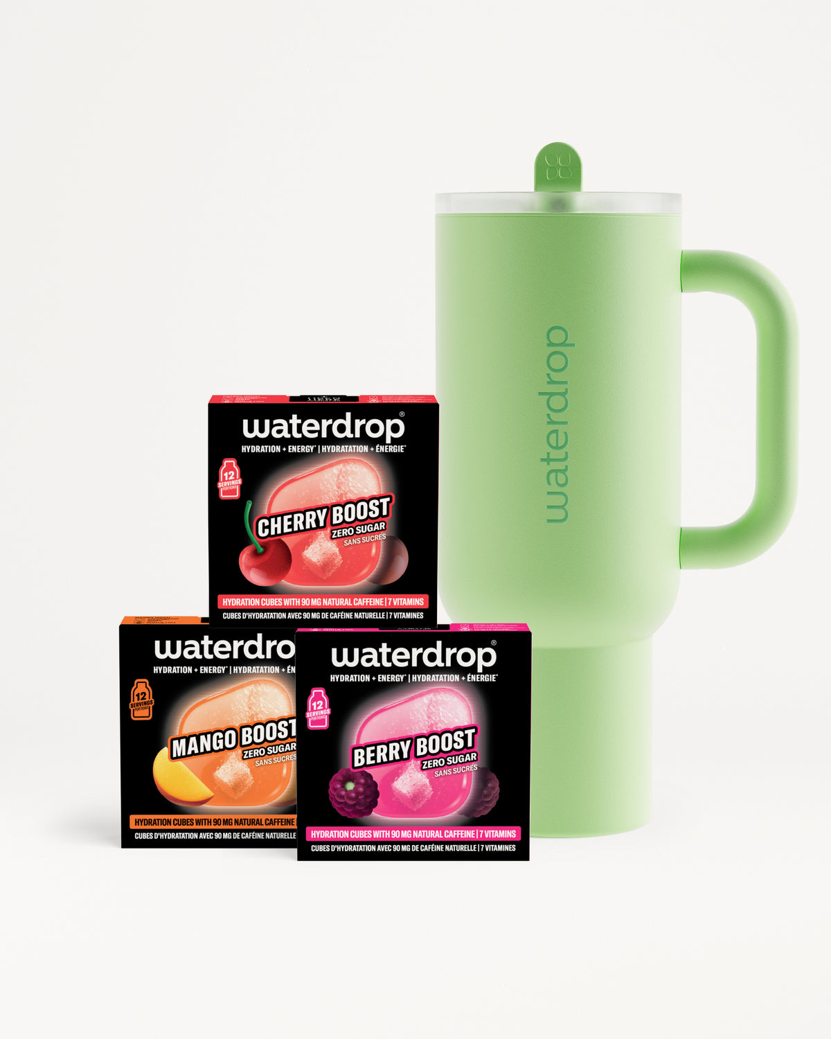 Drei Flavor-Boosterboxen in Orange, Pink und Lila neben einer lichtgrünen, isolierten Tasse mit Griff.