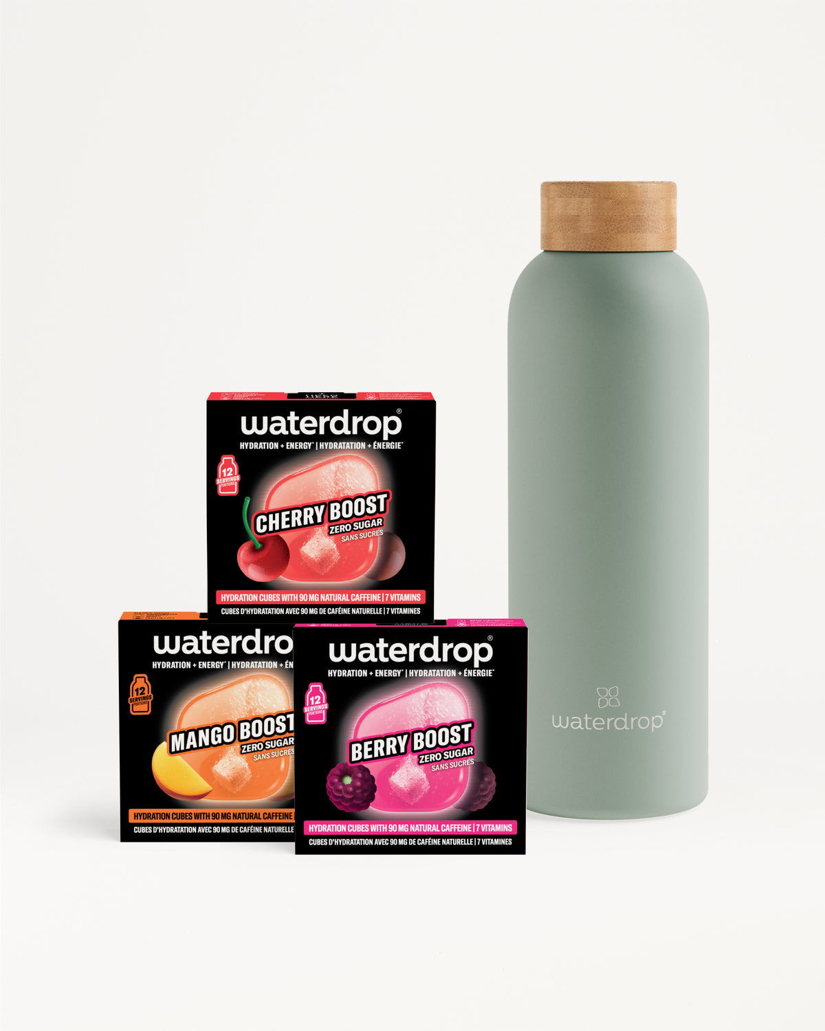 Drei Waterdrop Boost-Boxen mit Geschmacksrichtungen vor einer hellgrauen Flasche mit Holzdeckel.