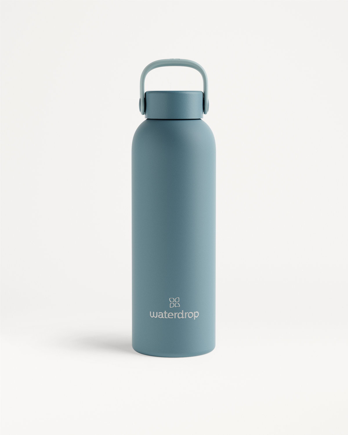 Thermo Steel Bottle · Carry Cap, mattes Edelstahl-Design mit Wasserdrop-Logo.