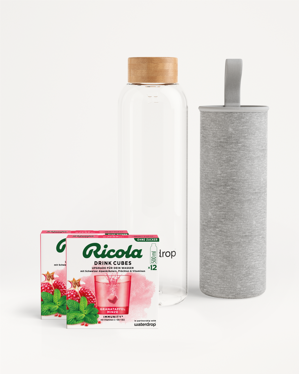 Ricola Bottle Set mit Getränkewürfeln und Glasflasche.