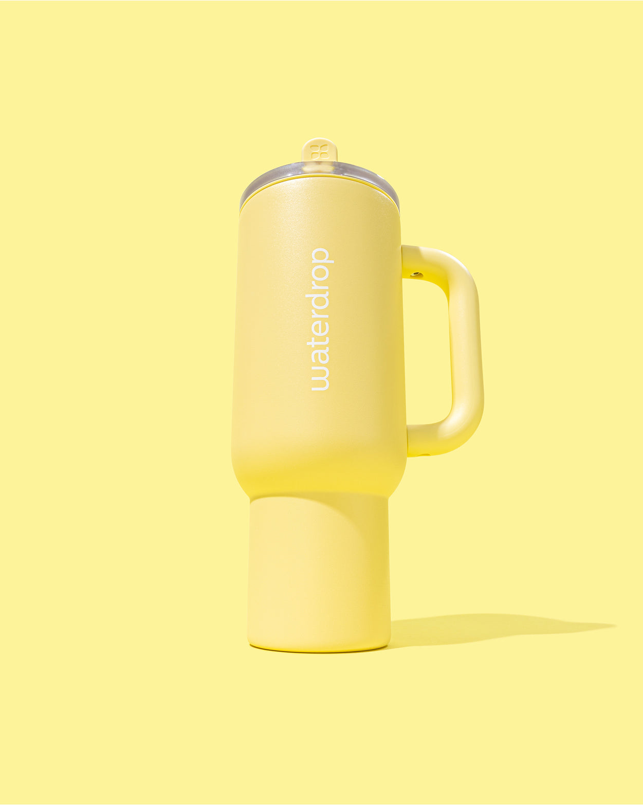 Buttergelb Explorer Thermo Tumbler mit Henkel und auslaufsicherem Deckel.