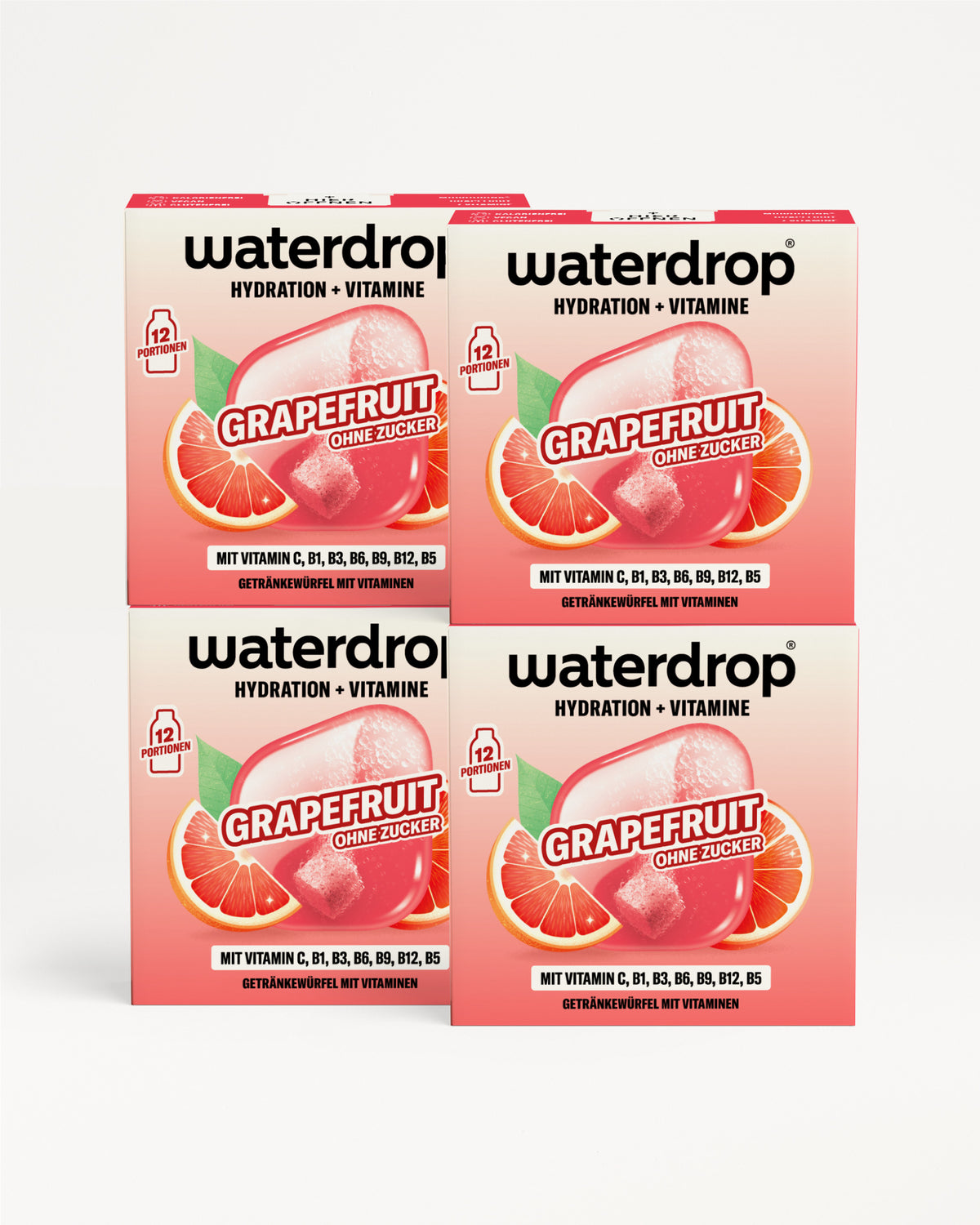 Vier Waterdrop-Beutel mit Hydration und Vitaminen Grapefruit-Geschmack in einer 2×2-Anordnung vor pinkem Hintergrund.