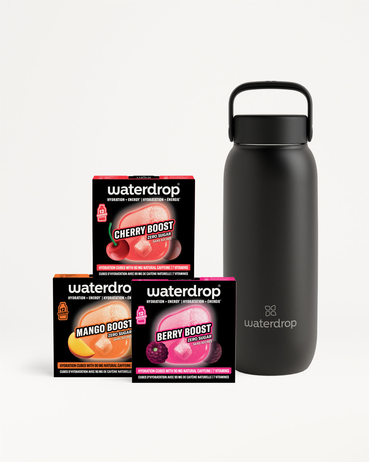 Dunkelgraue, wiederverwendbare Wasserflasche mit Griff neben drei Boxen Geschmackskonzentrat.