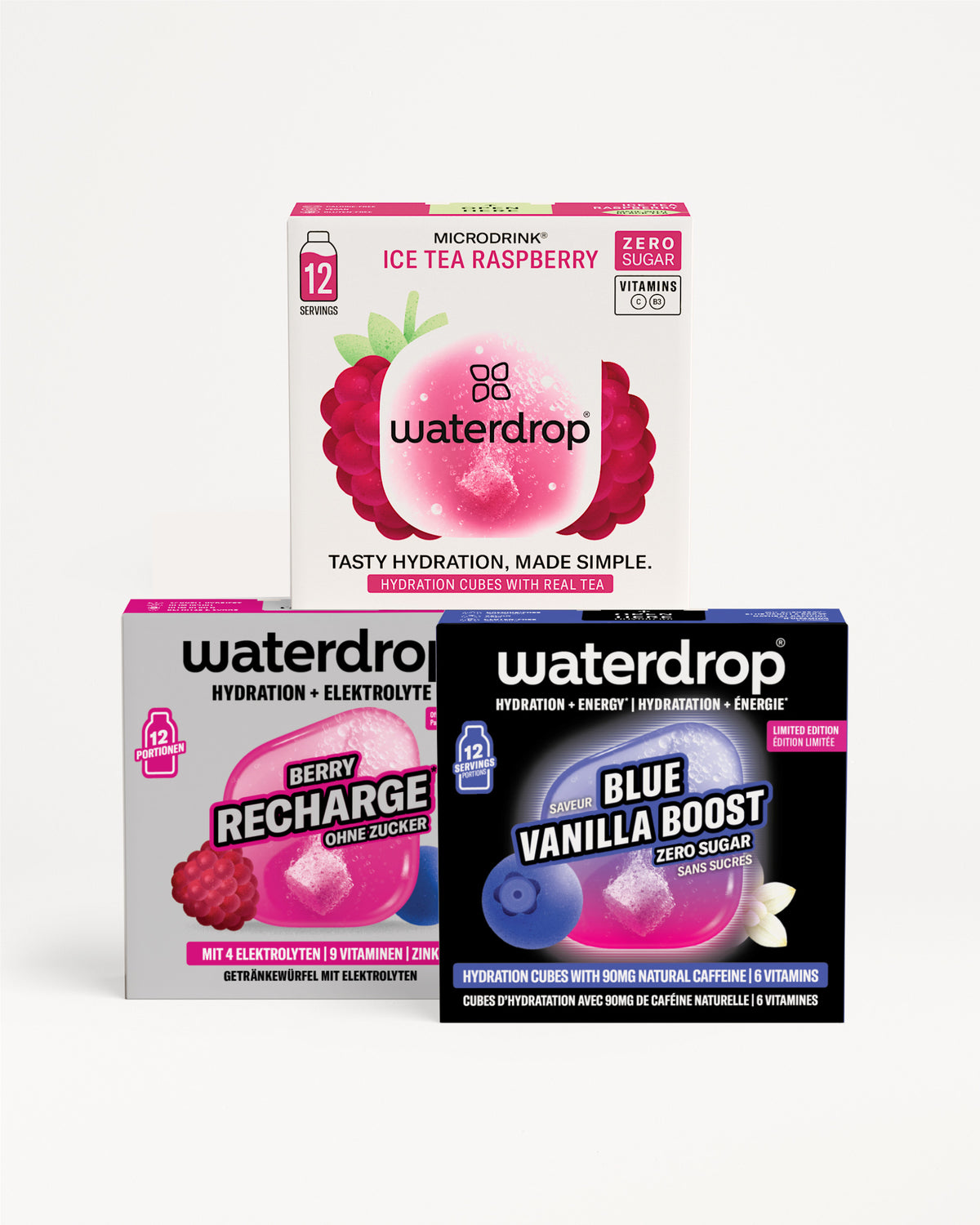 Drei Waterdrop-Hydration-Kästchen gestapelt in einer Pyramide, mit pinker, lila und blauer Verpackung.