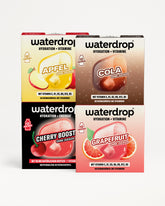 Vier Waterdrop Getränke-Packungen für Hydration und Vitamine in einer 2x2-Anordnung, jeder Geschmack durch eine farbige Verpackung dargestellt.