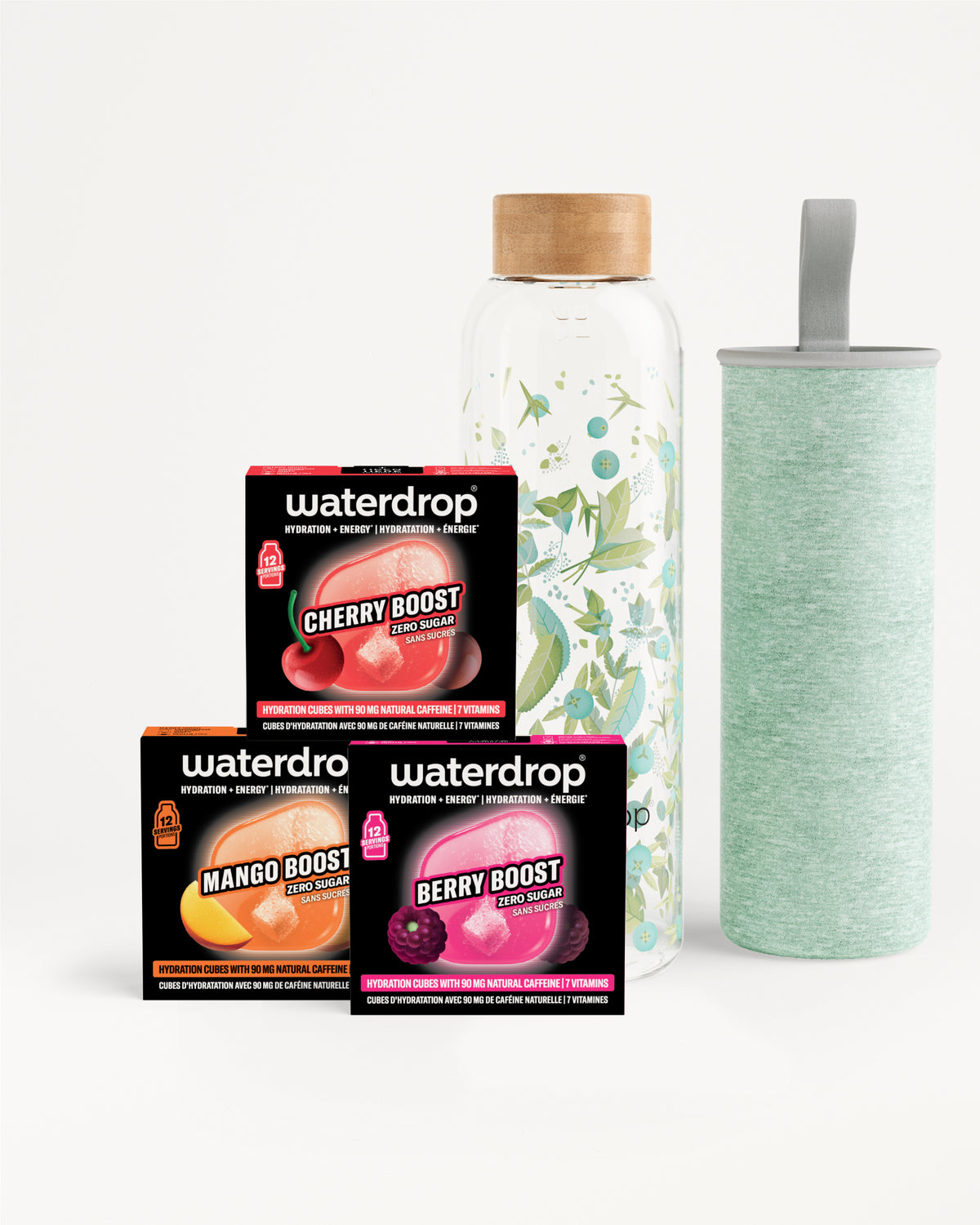 Set aus drei Waterdrop Flavor Boost‑Boxen mit einer Glasflasche mit Holzdeckel und einem hellgrünen Becher.