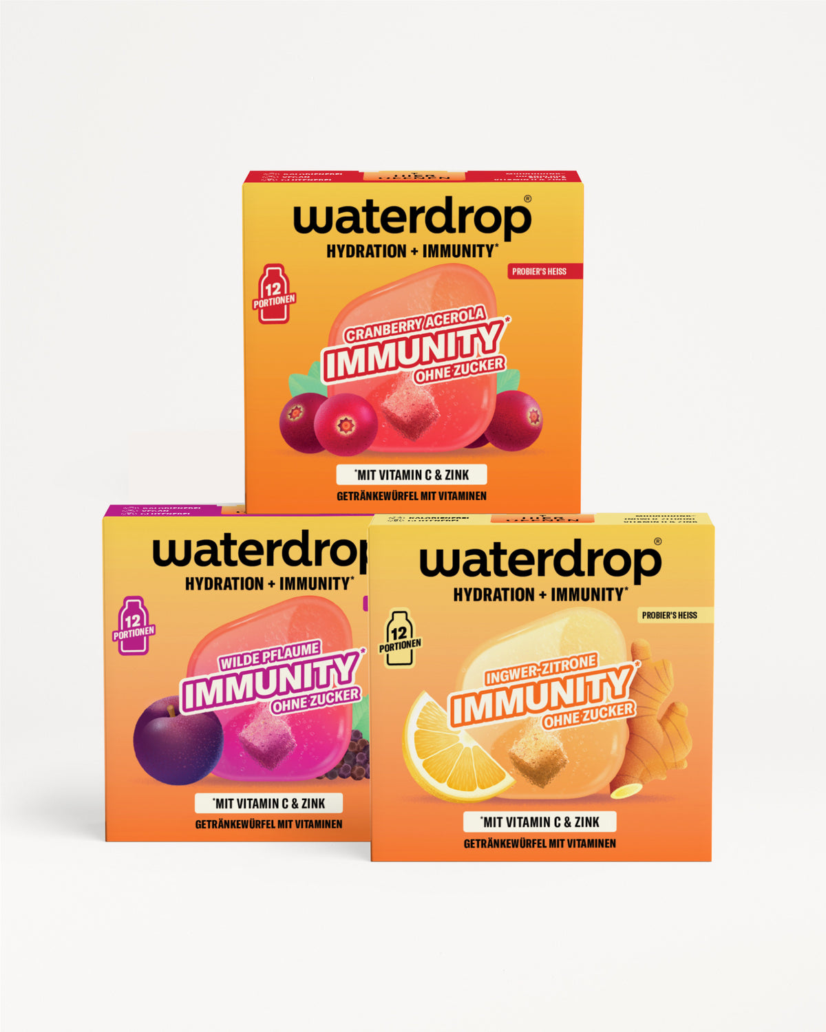 Drei Waterdrop-Boxen für Hydration und Immunität, stapelbar in einer Pyramide mit lila, gelb und orange Verpackung.