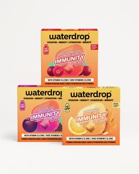 Drei Waterdrop Immunity Verpackungen stapeln sich pyramidenförmig vor weißem Hintergrund.