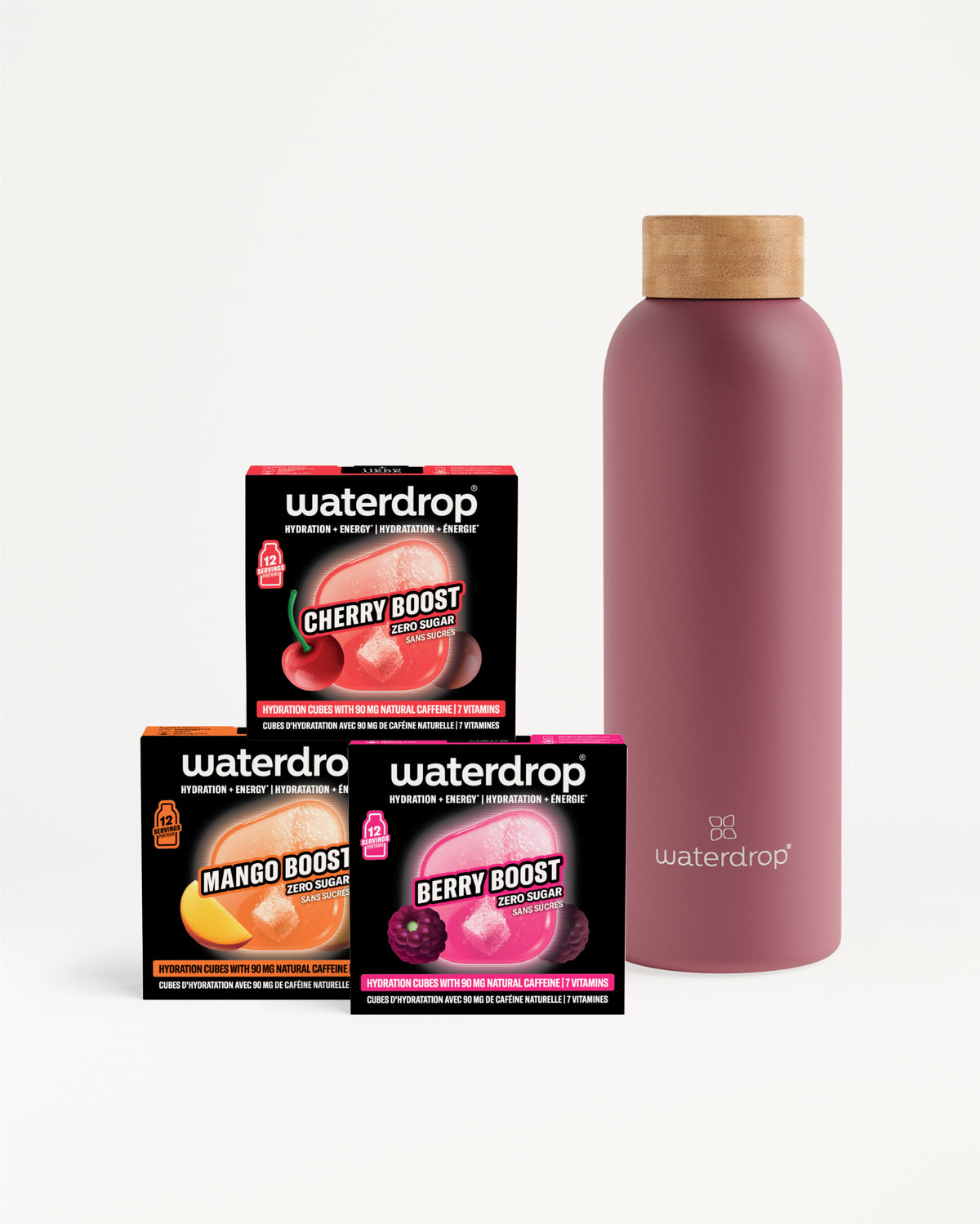 Drei kompakte Waterdrop-Geschmacks-Booster-Boxen neben einer rosafarbenen wiederverwendbaren Flasche mit Holzkopf.