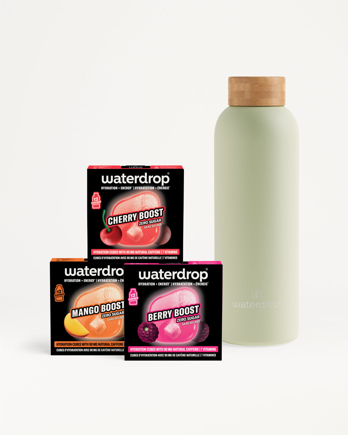 Drei Waterdrop-Boosterboxen (Cherry, Mango, Berry) neben einer hellgrünen Flasche mit Holzdeckel.