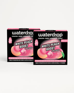 Zwei schwarze Waterdrop Hydration-Produktboxen mit pinken Akzenten vor weißem Hintergrund.